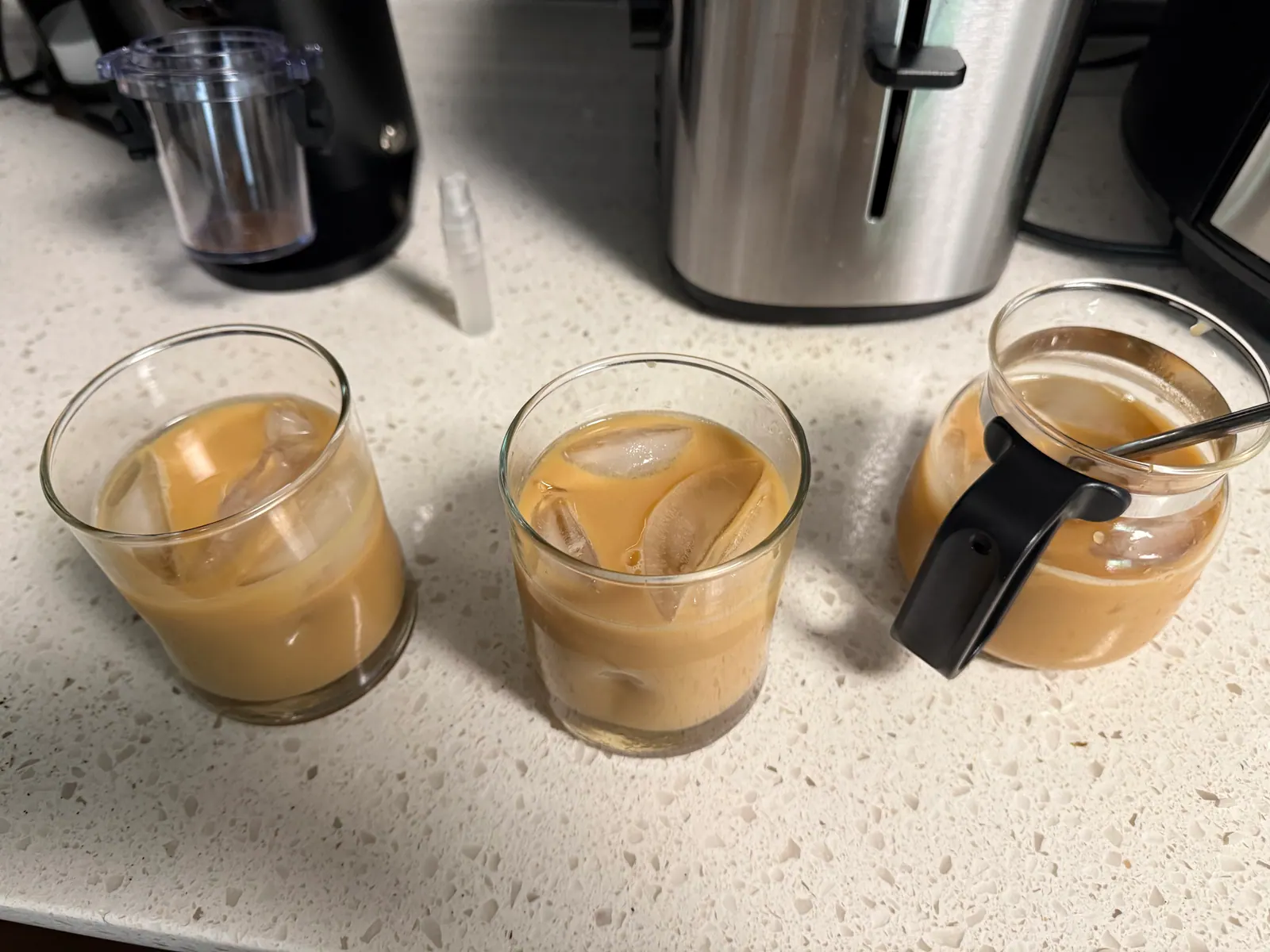 All three cups with milk and ice